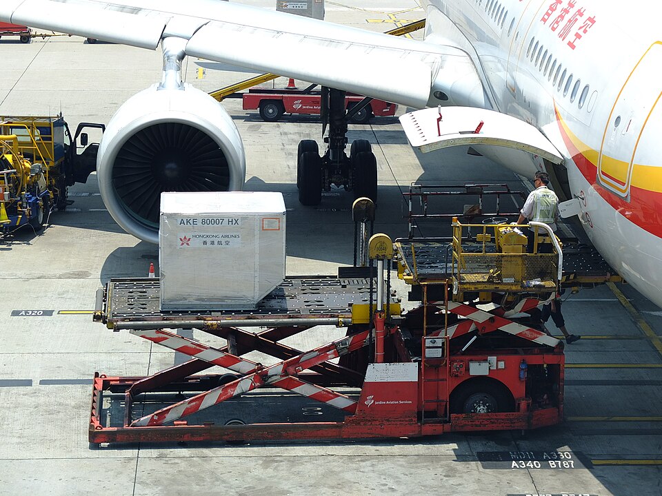 Ground crew operating a cargo loader