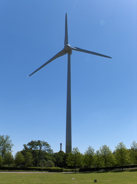 Wind turbine over green parkland